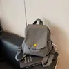 2026 Nuevo Multifuncional Ligero Simple Portátil Repelente al Agua Estilo Pareja Hombres Mujeres Versión Coreana Nicho Mochila Pequeña