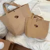 Bolsa de Mano de Papel Kraft con Perrito de Dibujos Animados Estilo Nuevo Simple Gran Capacidad Bolsa Tote Viaje de Negocios Trayectos Diarios Versátil Bolsa de Hombro