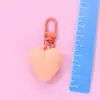 Llavero de corazón de melocotón nuevo color caramelo amor funda protectora aipods funda para auriculares colgante adornos para bolso