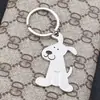 Llavero creativo de metal para hombre y mujer, llavero personalizado, colgante de perro brillante, regalo con logotipo de empresa
