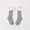 Calcetines infantiles de primavera al por mayor lindos Corea del Sur otoño e invierno nuevos creativos alas de ángel calcetines de bebé de canalé