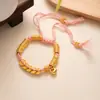 Nuevo Estilo Chino Envoltura Antigua Fa Sha Pulsera Dorada Amarillo Dorado Dios de la Riqueza Marca Redonda Pulsera de Cuerda Roja Cintura de Hombres y Mujeres Línea de Cintura