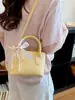Bolso Cubo Amarillo Súper Trendy de Verano para Mujer 2026 Nuevo Bolso de Lujo para Mujer Coreano de Nicho Bolso de Hombro Cruzado para Teléfono