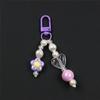 Llavero colgante para bolso de perlas con forma de flor pequeña de color AB electrochapado nuevo creativo directo de fábrica hecho a mano con cuentas