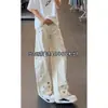 Jeans de hombre con dobladillo curvo bordado, nuevo estilo de verano, estilo americano, elegantes y de alta gama, diseño de nicho, pantalones ligeramente acampanados