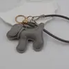 Funda para teléfono con borla de cachorro linda creativa, correa para llavero de coche, accesorio para bolso, universal para teléfonos móviles