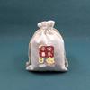 Bolsa de regalo de algodón blanco de alta densidad con cordón ajustable, ideal para guardar joyas, dulces navideños y manualidades.