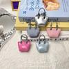 Nuevo Colgante de Mini Bolso Colorido Cadena Exquisita Accesorio de Bolso Pequeño de Cuero Mini Bolso de Cuero con Cera de Aceite Colgante para Coche
