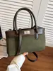 Bolso de hombro de moda versátil nuevo de principios de otoño Yaozi 2026, un bolso de mano elegante y práctico para ir al trabajo, con un diseño simple y casual, y también se puede llevar como bolso cruzado