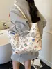 Bolso Graffiti de Gran Capacidad Transfronterizo para Mujer 2025 Nuevo Bolso de Hombro Versátil Casual Bolso Tote de Nicho para el Trabajo