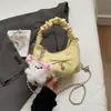 Bolsa Pequena Plissada com Laço Estilo Novo Primavera 2026 Bolsa de Mão Feminina Retrô Bolsa Nuvem Bolsa Transversal com Corrente Bolsa de Trabalho