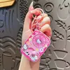 Novo chaveiro giratório UV de desenho animado Sanrio, fofo Kuromi KT brinquedo divertido, pingente de mochila de estudante