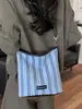Bolsa de moda listrada de grande capacidade para mulheres 2026 nova bolsa tote de ombro casual moda executiva bolsa de balde tendência
