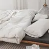 Juego de cuatro piezas de algodón 100% teñido en hilo y lavado, algodón puro, sin marca, suministrado por el fabricante, funda de edredón de alta calidad, sábana bajera de estilo japonés, ropa de cama al por mayor