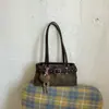 Bolso de gamuza de gran capacidad para mujer transfronterizo, nuevo bolso de hombro o axila para commuting otoño 2026, bolso de mano versátil vintage