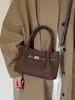 Bolso pequeño vintage transfronterizo para mujer, modelo nuevo 2026, bolso tipo cubo de alta gama, bolso cruzado de moda para el día a día