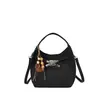 Bolso de mano de nicho estilo coreano para mujer, nueva colección de invierno 2026, bolso de hombro retro, adecuado para el trabajo y los desplazamientos, bolso tipo cubo