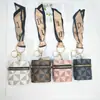 Bolsa de Armazenamento Portátil em Couro PU de Luxo Leve Estilo Francês com Padrão Geométrico, Porta-Cartões Mini, Chaveiro com Pingente Cilíndrico de Alta Qualidade