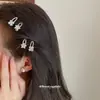 Pinza para el pelo lateral de flor de trébol de cuatro hojas con estrella de pedrería, pinza de pico de pato versátil para ir al trabajo, accesorio para el pelo de lujo ligero y de alta gama para mujer