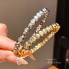 Pulsera geométrica de circonita chapada en oro real de 18k, sensación de lujo ligero de alta gama, diseño de nicho, joyería versátil al por mayor