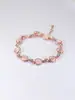 Pequeño al por mayor joyería de ojo de gato en forma de corazón para mujer europea y americana dorada pulsera geométrica chapada en oro rosa para mujer