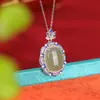 Yuebao Joyería Jade Hetian Natural Plata Pura S990 Jade Agua Clara Ruyi Esmalte Superficie de Huevo Anillo Colgante Tendencia Nacional Atmosférico