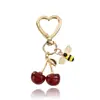 Llavero de hoja de oro K estilo coreano con cerezas, colgante fresco de margarita, abeja, fruta y corazón, decoración para bolso de niña