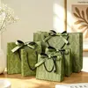Bolsa de Regalo Flor Europea Qili Guqi Verde admite impresión de logo, bolsa de embalaje de bolso de mano con lazo elegante de alta gama