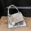 Bolso de mano casual elegante Shuai Mi Jia para mujer, nuevo modelo principios de otoño 2026, bolso cuadrado pequeño simple, bolso bandolera de moda