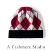 Moda tejida otoño e invierno nuevo jacquard de cachemira color cálido bloque de color gorro, gorro grueso tejido de punto con vuelta en la parte superior redonda