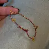 Popular Colgante de Hilo Rojo Xiaohongshu Pulsera de Cuerda Roja de Año Nuevo para Mujeres en su Año Zodiacal, Año del Caballo, Pulsera de Cuerda Trenzada Roja, Una Pieza al por Mayor