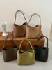 Bolsa tote casual de cor sólida estilo retrô, nova coleção outono 2026, adequada para o trabalho e o trajeto diário, com um design único para carregar sob o braço