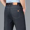 Jeans elásticos para hombre, estilo nuevo, casual de negocios, algodón de seda helada, corte recto holgado, finos, no se planchan, pantalones largos para hombres de mediana edad