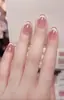 Celebridad de Internet Temperamento Rojo Bayo Degradado Rojo de Año Nuevo Arte de Uñas Rojo Primavera y Verano Hecho a Mano Puro Uñas Largas Vestido Largo Uñas Postizas Blancas