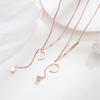 Collar nuevo de acero de titanio europeo y americano para mujer, oro rosa, letra d, borla de diamantes, cadena para clavícula, joyería de moda de lujo ligero al por mayor