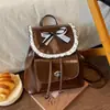 Nueva mochila versátil de moda de principios de otoño transfronteriza con lazo para estudiantes, mochila escolar, mochila pequeña para viajes y desplazamientos
