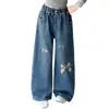 Pantalones infantiles transfronterizos otoño 2026 nuevo estilo jeans holgados para niños niños grandes modernos estampados lavados de pierna ancha