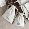 Bolsa de almacenamiento personalizada de lino natural con cordón en beige vintage para tiendas de joyería transfronterizas, bolsa pequeña de tela para empaque de joyería