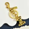Bestseller transfronterizo: colgante vintage de cachorro lindo tridimensional, llavero de metal en esquema de color dorado y plateado envejecido, accesorio de dibujos animados