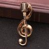 Venta caliente transfronteriza nuevo moda retro europea y americana broche de micrófono musical pin de nota de micrófono aleación oro kc
