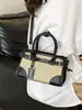 Bolso pequeño de color block de moda transfronterizo para mujer, nuevo bolso de mano de nicho de alta gama, bolso de hombro y bandolera tejido para el trabajo, moderno