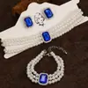 Collar y pulsera de perlas de imitación con flor de diamante francés, cadena de clavícula de nicho de moda, joyería de alta gama que combina con todo.