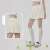Falda plisada de yoga para mujer con bolsillo para tenis incorporado, cintura elástica, control de abdomen, efecto de alargamiento de piernas, minifalda deportiva