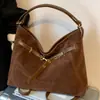 Bolsa fosca vintage de grande capacidade para mulheres, nova bolsa de ombro casual versátil 2026, bolsa tote para o dia a dia, mochila de ombro duplo
