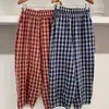 Pantalones retro de cuadros de pierna ancha para mujer, cintura elástica, corte holgado, adelgazantes, pantalones casuales versátiles, pantalones largos versátiles para mujer con estampado de cuadros