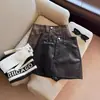 Falda corta de cuero PU para mujer 2026 otoño e invierno nueva falda negra de cintura alta, minifalda de cuero bodycon sexy línea A