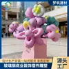 Escultura de flor de balão de desenho animado em fibra de vidro, uma peça decorativa para criar uma atmosfera de abertura em shoppings e ruas comerciais