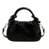 Bolso de mano vertical a rayas texturizado transfronterizo para mujer 2025 nuevo diseño de nicho moderno versátil hombro bandolera al por mayor
