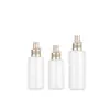 Nueva Botella Pulverizadora Redonda de 80 ml con Atomizador Fino Ximeng en Stock, con Boquilla Dorada Mate, Botella Dispensadora de Producto para Cuidado Facial Hidratante de Color Café