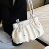Bolso de cubo plisado elegante de mano para mujer 2026 verano nuevo bolso casual simple de un solo hombro versión coreana sensación de alta gama bolso de mujer